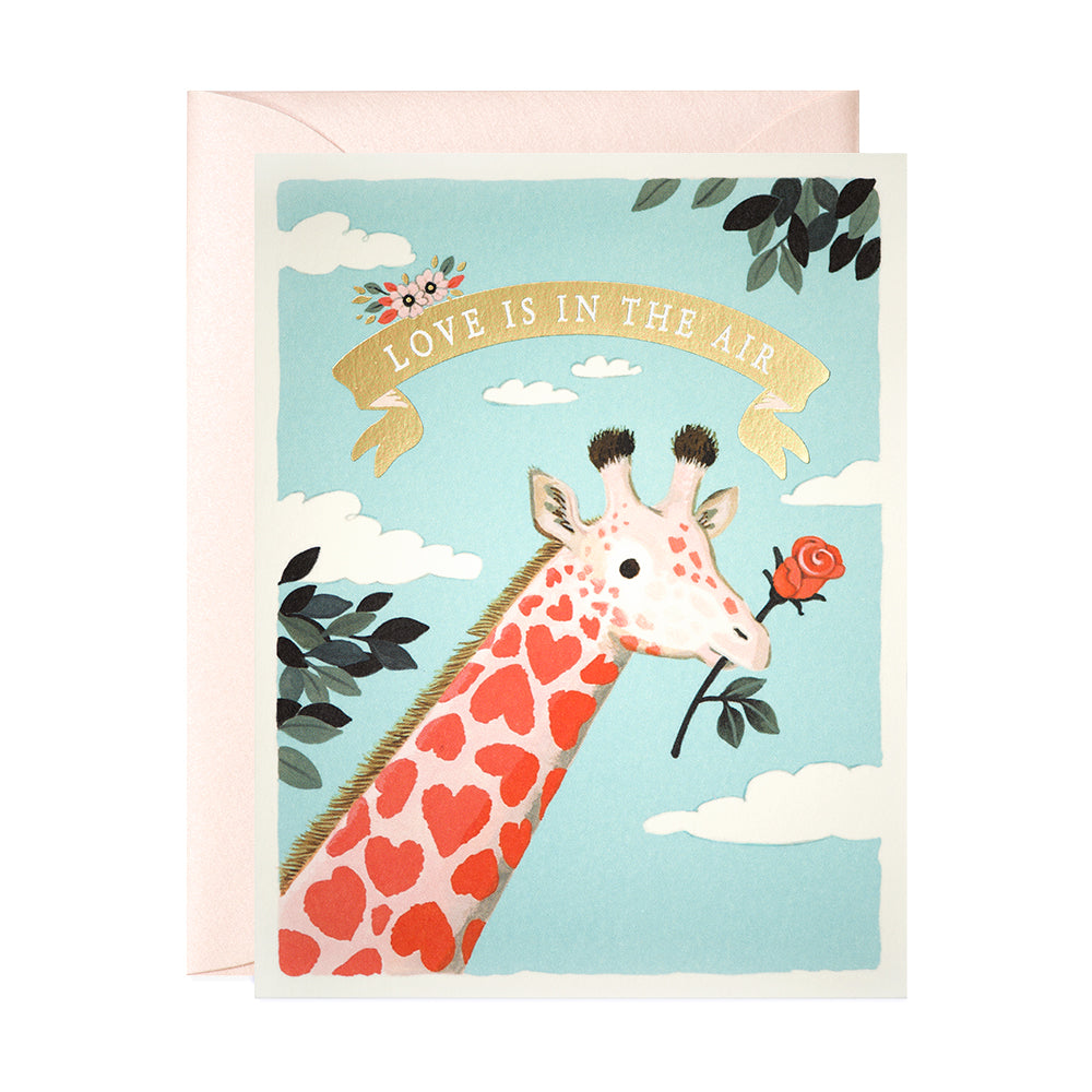 Pink and red giraffe love is in the air greeting card by JooJoo Paper