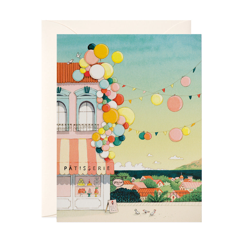 Balloon clusters in a coastal city birthday greeting card