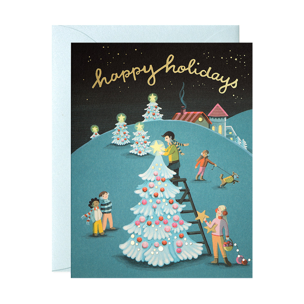 A family decorating a Christmas Tree Happy Holidays Greeting Card by JooJoo Paper