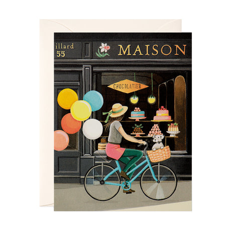 Girl on bike looking at French Chocolate and pastry window Shop Maison Birthday Greeting Card