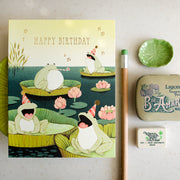 Frogs singing between lotus flowers hand painted funny birthday greeting card by Afsaneh Tajvidi