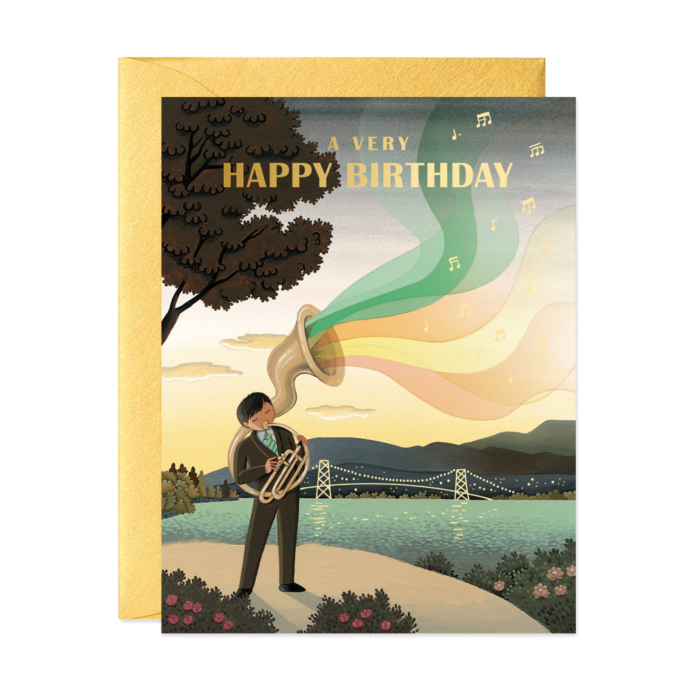 Tuba player standing by the water at sunset birthday greeting card